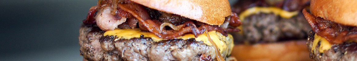Eating Barbeque Burger at Jalen's Bar-B-Q & Grille restaurant in Folkston, GA.